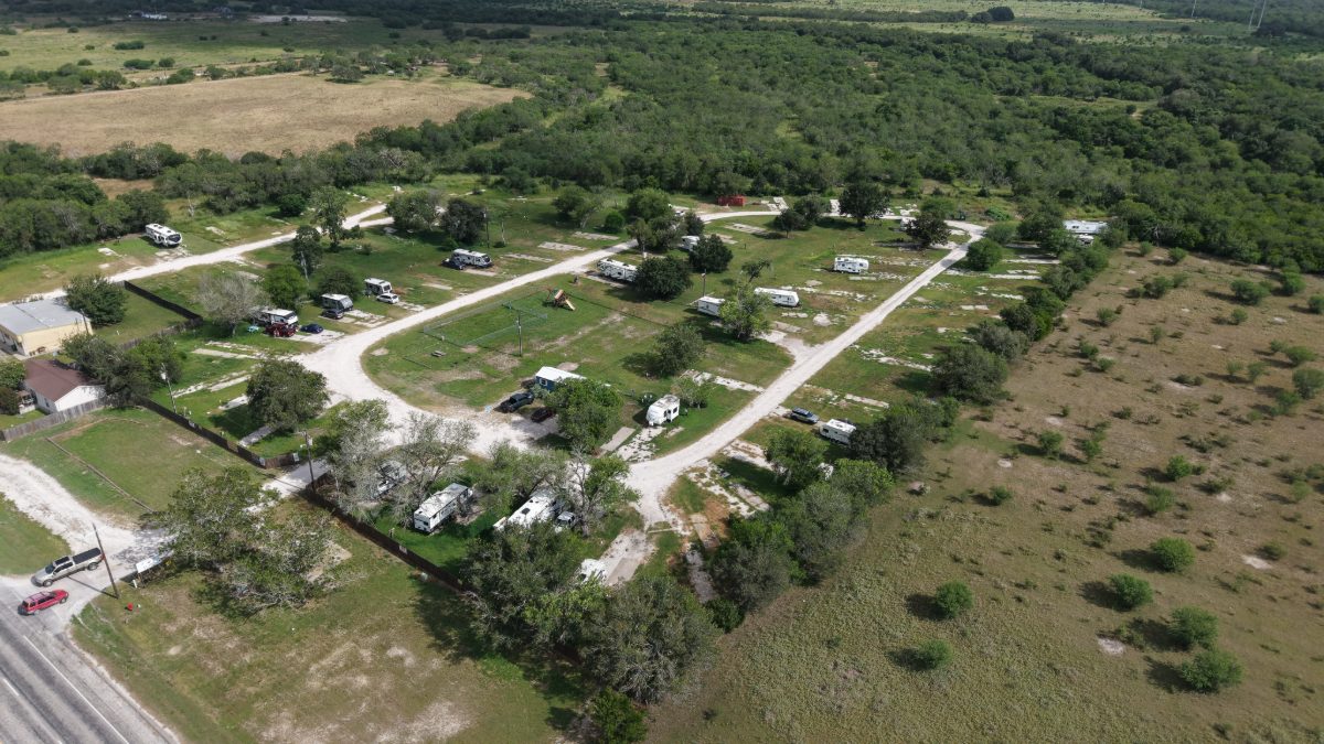 Aerial view of the interior roads and open sites at The Texas Rose RV Park in Beeville, TX